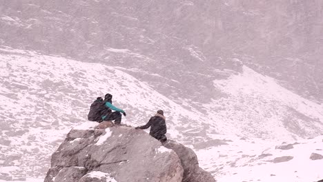 hikers resting on a hike.rock