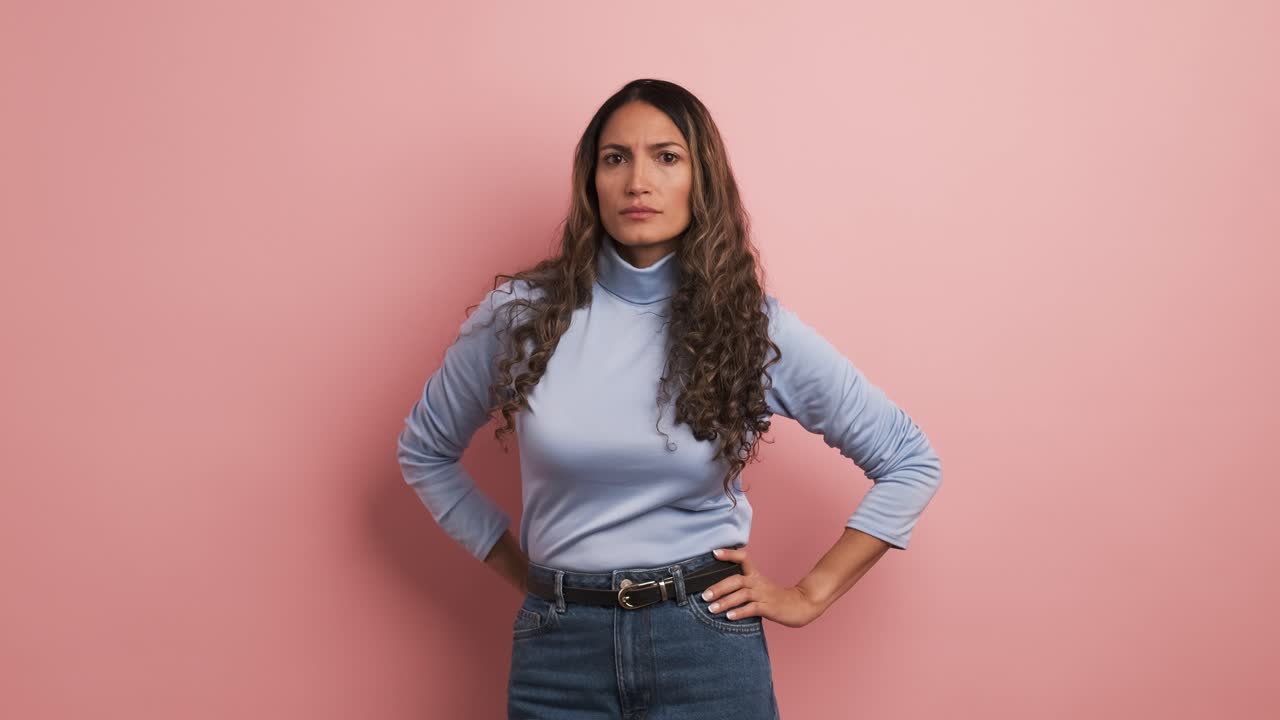 Serious hispanic woman looking at the camera with angry expression