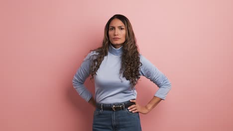 serious hispanic woman looking at the camera with angry expression