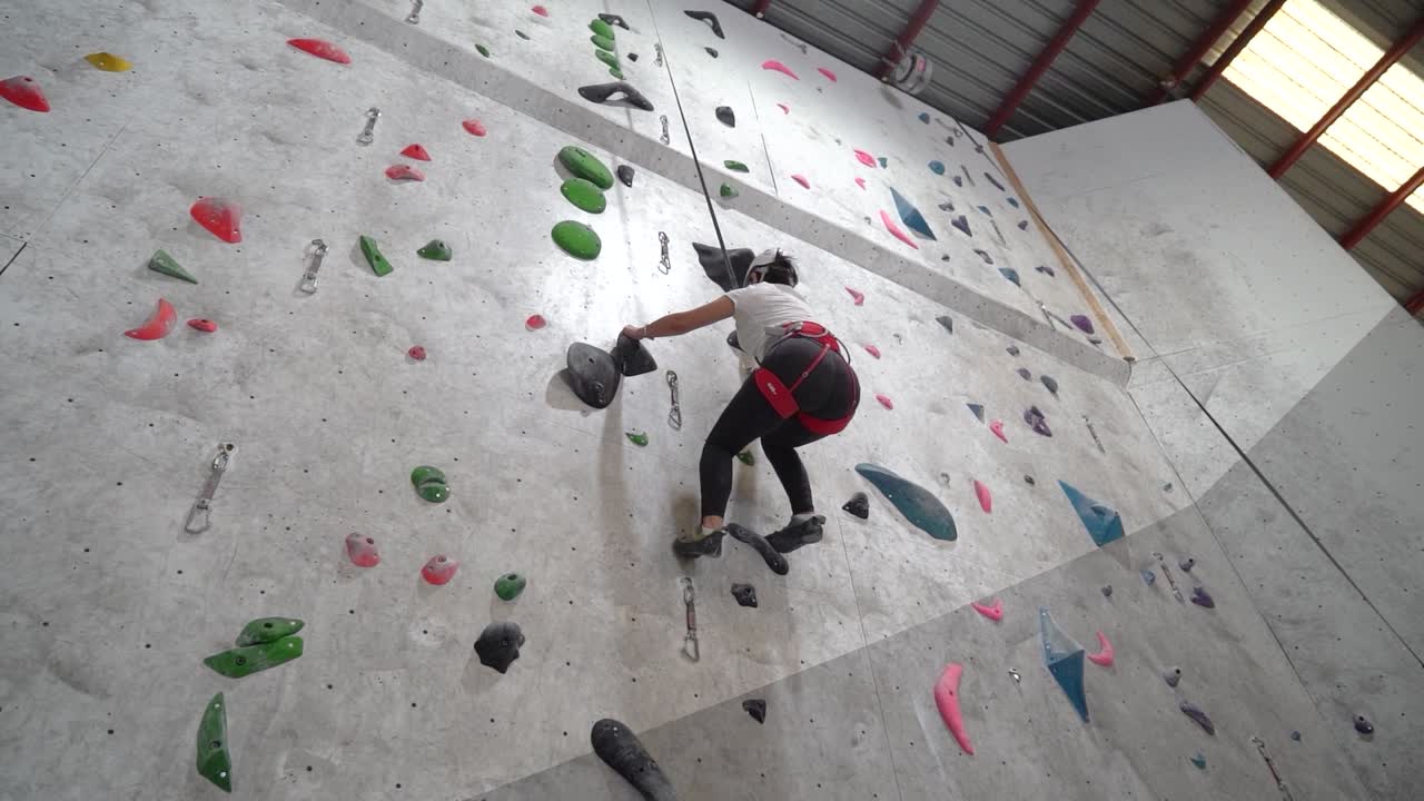 Two People Indoor Rock Climbing
