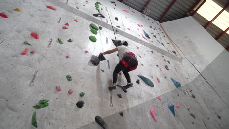 two people indoor rock climbing