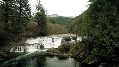 dramatic slow motion aerial towards dougan falls on washougal river