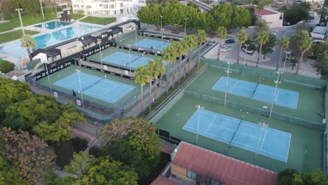 aerial of outdoor tennis courts and pool in sports complex