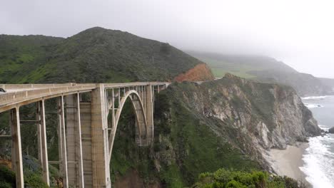 ultra slow motion shot of bixby creek bridge viewed from the side in california, usa