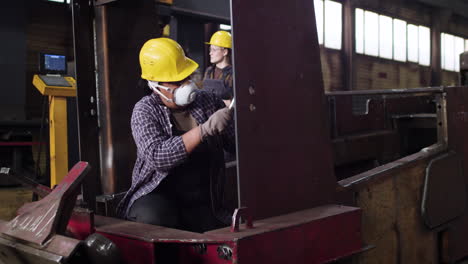 worker sanding down the structure