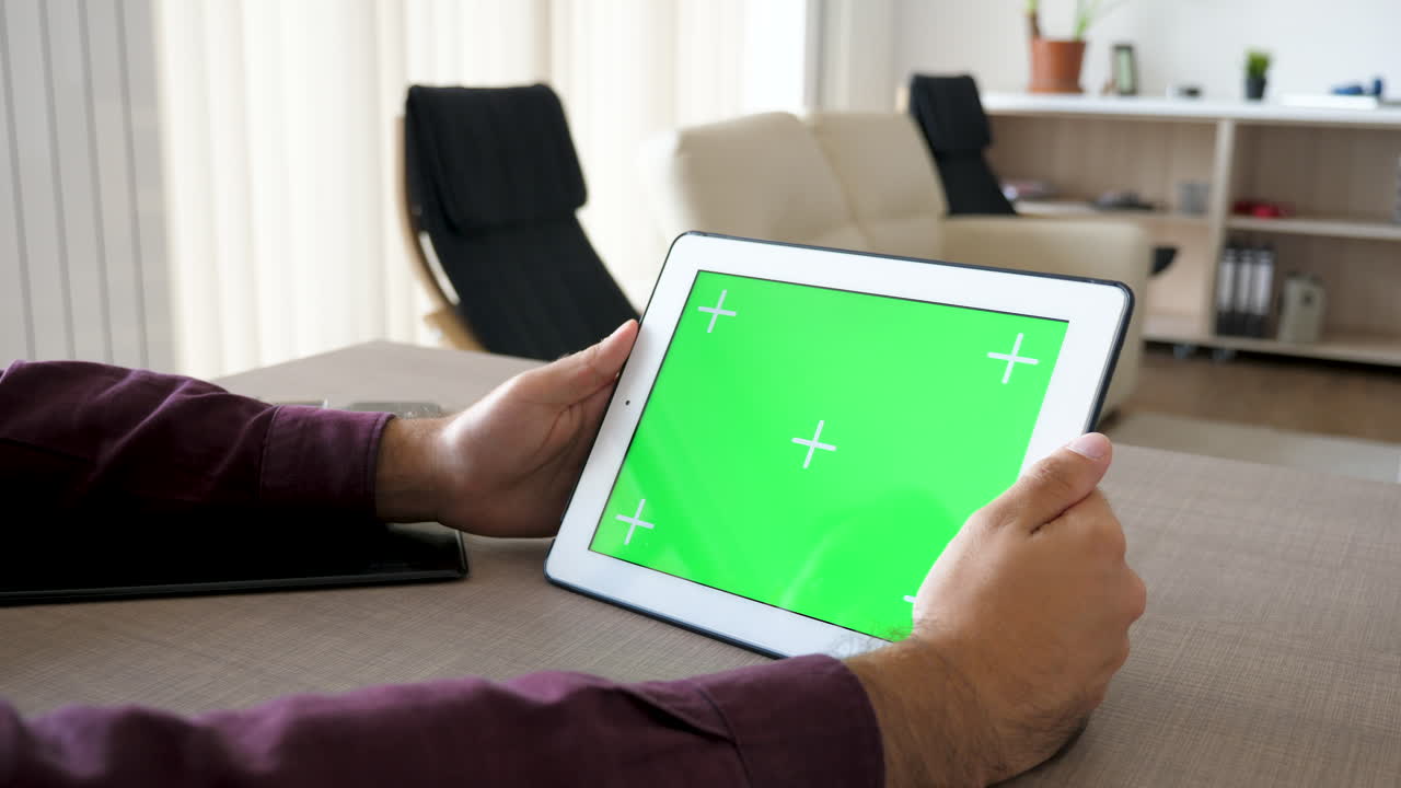 Tablet with green screen in home office