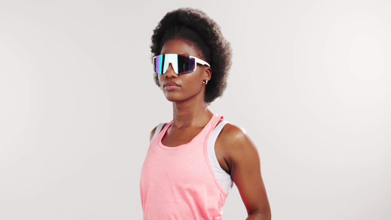 Confident African American Woman Posing in Futuristic Sunglasses