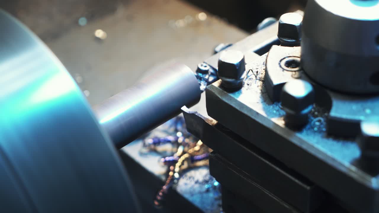 Industrial metal work machining process by cutting tool on CNC lathe. Metalworking equipment.