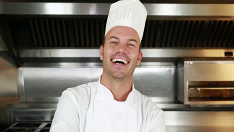 Smiling-chef-showing-a-plate-and-make-ok-sign
