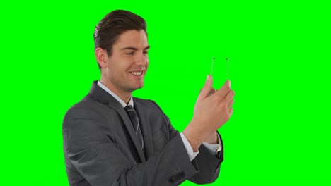 Businessman-pretending-to-use-mobile-phone