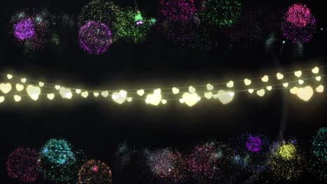 glowing string of fairy lights with fireworks