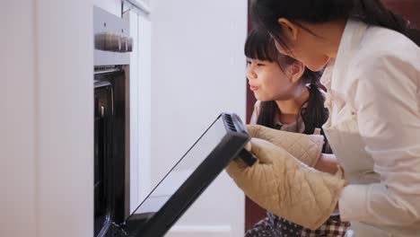 mother and daughter baking together