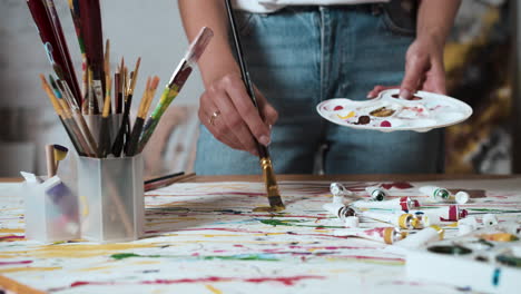 artist creating an abstract painting