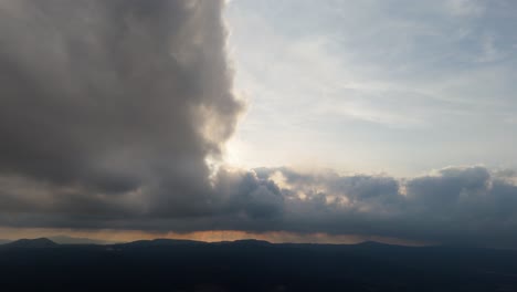 powerful sky with clouds rolling in, storm brewing on the distant horizon.