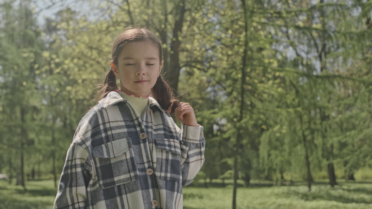 Portrait of Cute Girl on Summer Day in Park