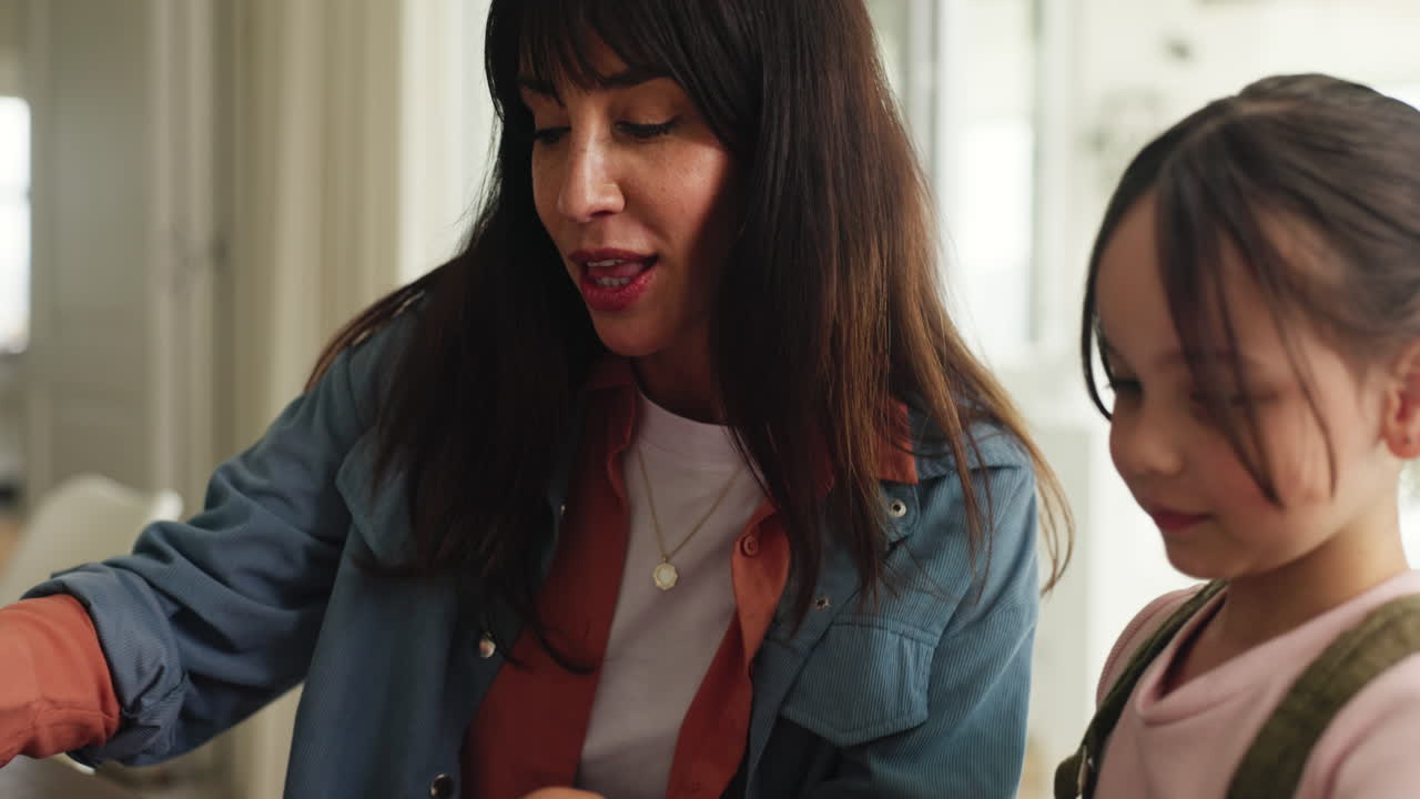 Mother and daughter looking at paperwork