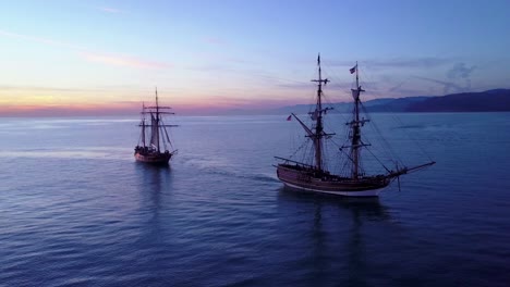 spectacular aerial of two tall sailing ships on the open ocean 3