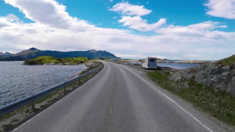 driving a car on a road in norway atlantic ocean road or the atlantic road (atlanterhavsveien) been awarded the title as (norwegian construction of the century).