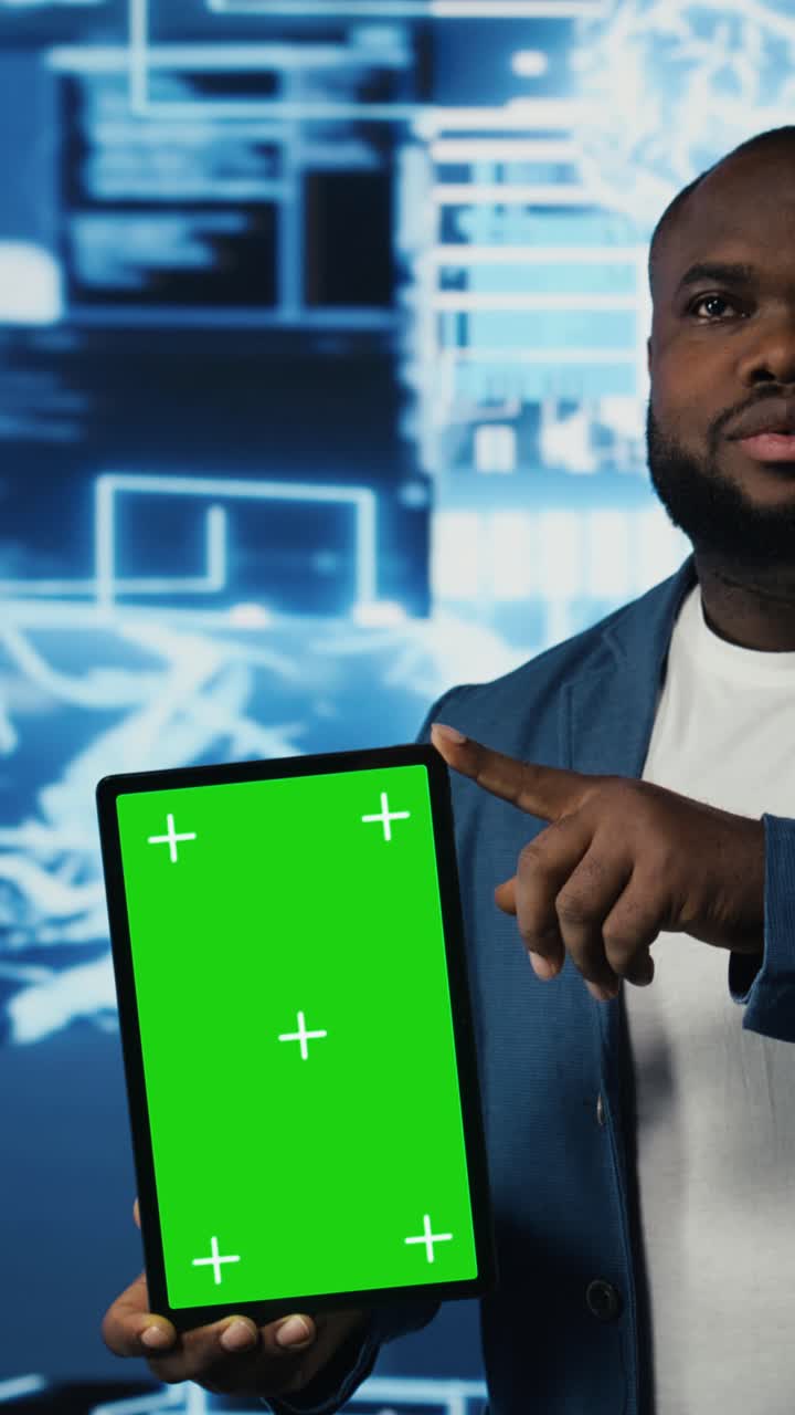 African American Man Holding Green Screen Tablet in Tech Office