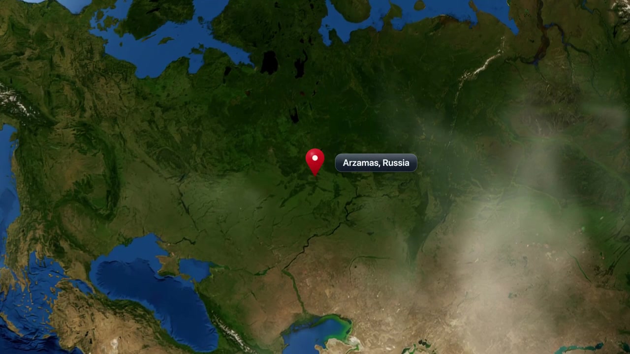 Satellite camera zooms rapidly from outer space into a map pin at Arzamas, Russia. Includes NASA public domain imagery.