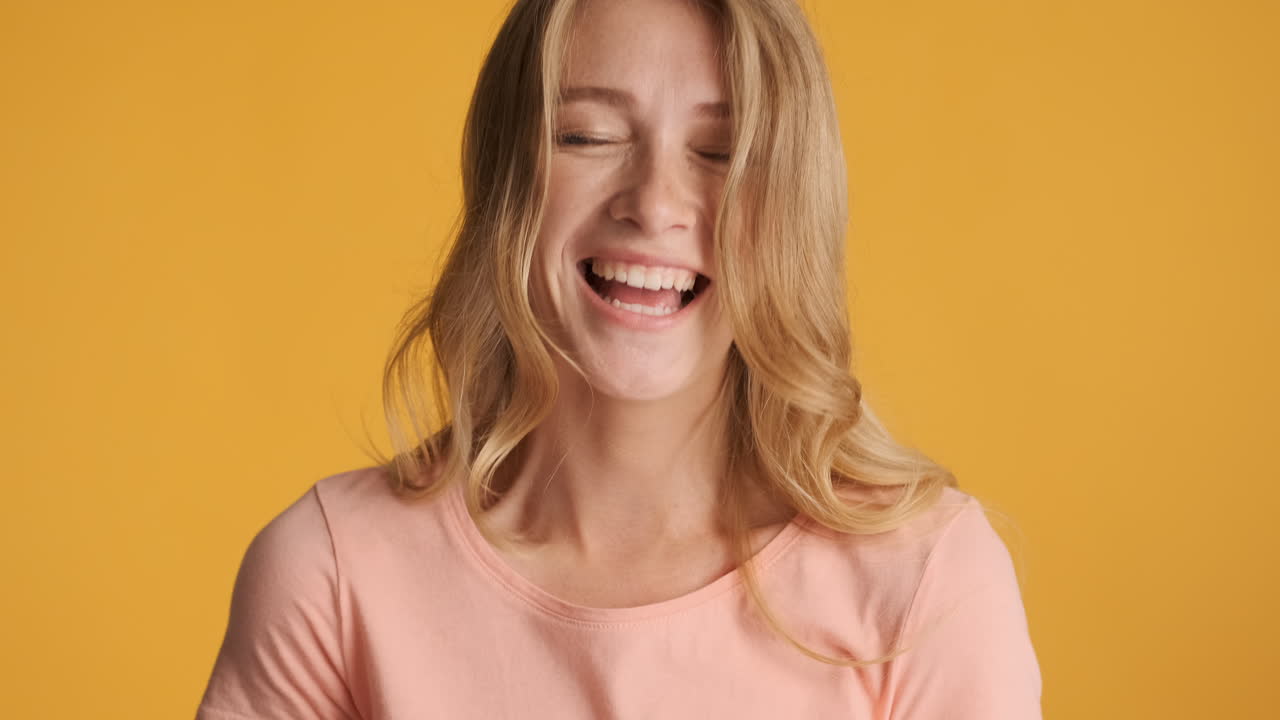 Caucasian woman fooling around on camera.