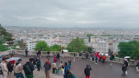 touristic panoramic view of paris city on top of the montmartre steps