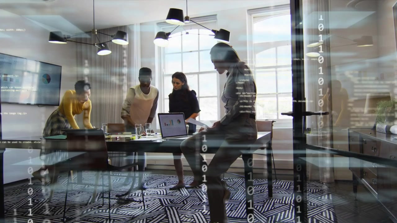 Four women working in business, binary overlay appearing and highlighting laptop chart for analysis