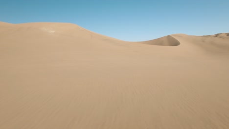Aerial-View-Of-Large-Dry-Desert-Sand-Dune-In-Huacachina,-Peru