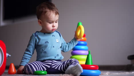 baby playing with stacking rings