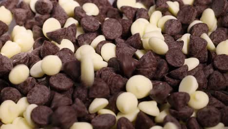 dark and white chocolate chips falling together