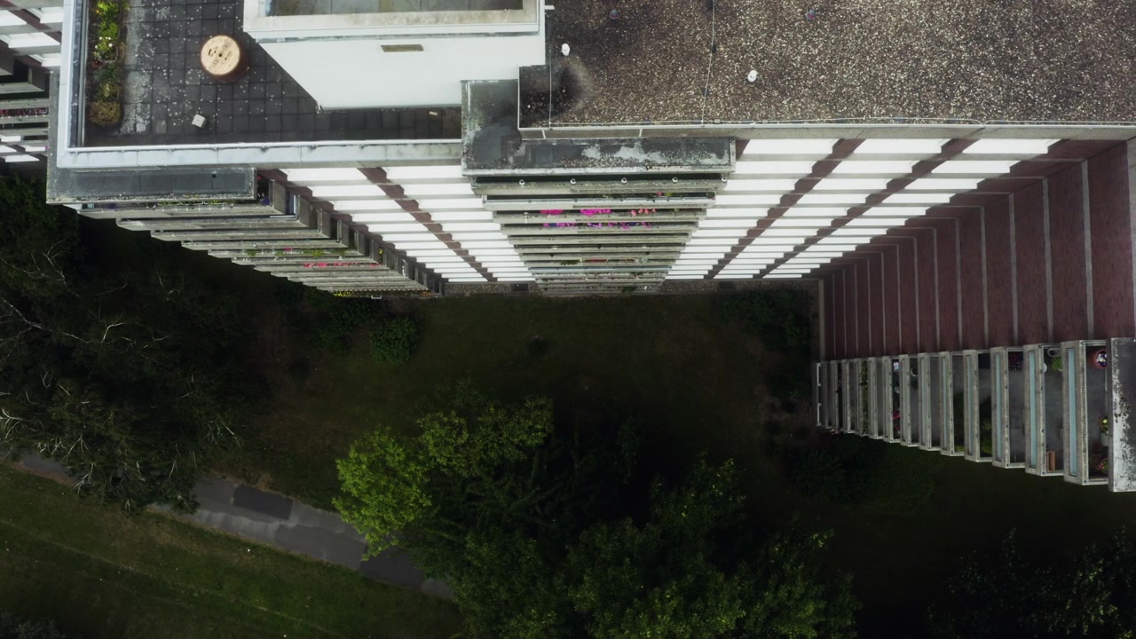 Rooftop balconies drop below in this vertigo-inducing pan across Cologne