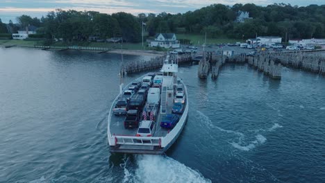 aerial drone shot of ferry approaching shelter island north fork long island new york before sunrise