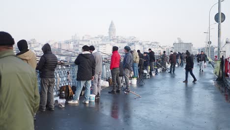 people fishing on a bridge in istanbul