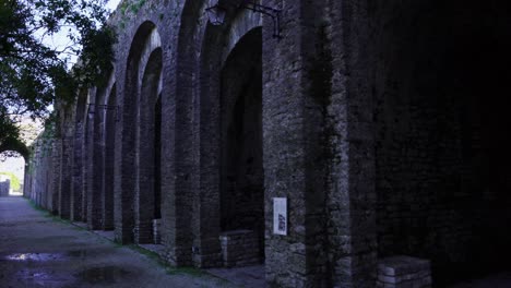 high arched walls of carved stone inside medieval fortress of gjirokaster, albania