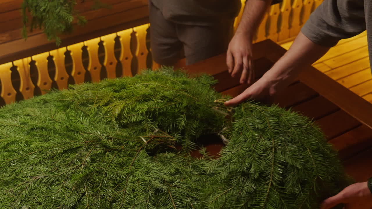 Preparing a Christmas Fir Wreath in a Sauna