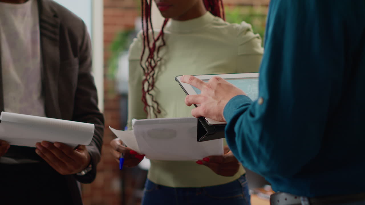 Diverse colleagues working on business partnership with charts information