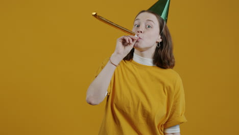 woman celebrating with party horn