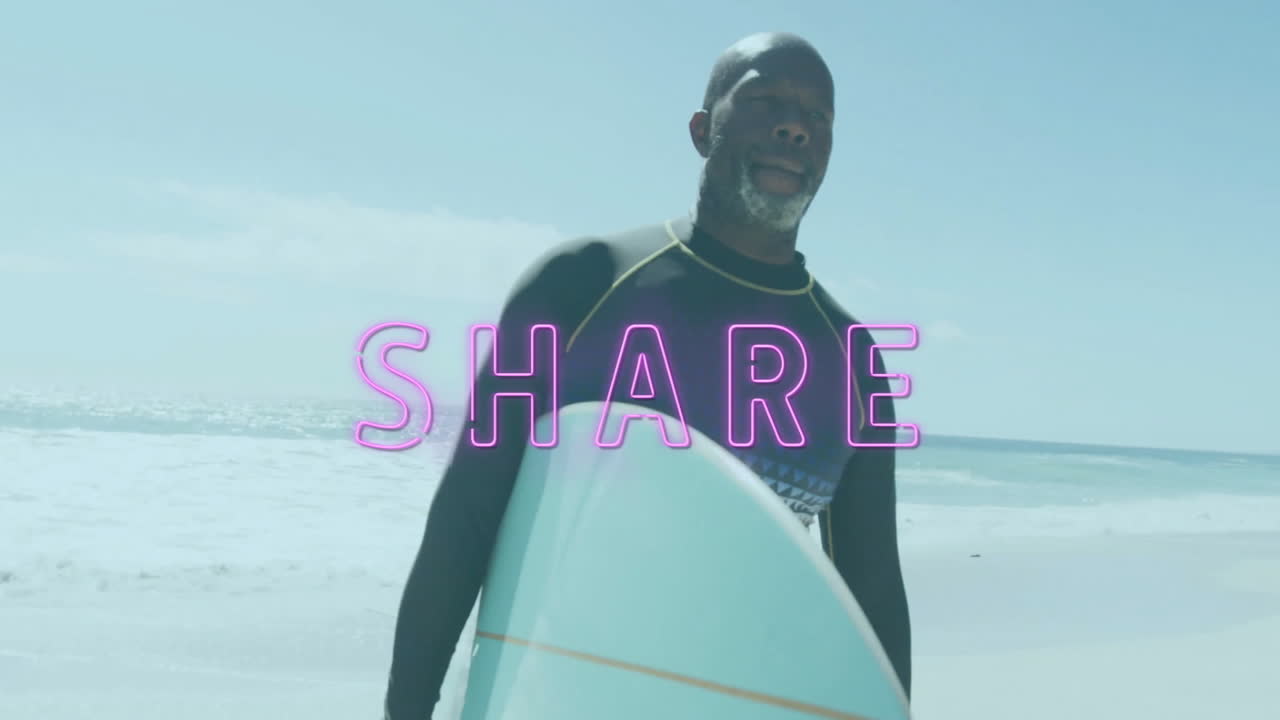 Carrying surfboard on beach, man with SHARE text overlay in pink letters