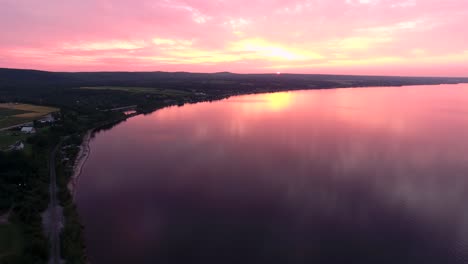 incredible pink sunset on a huge lake in quebec, canada