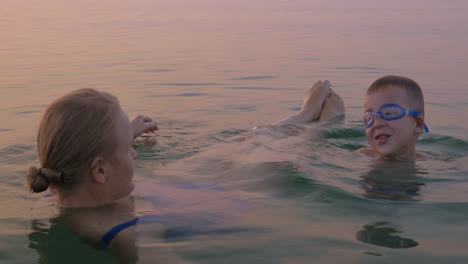 Mother-and-Son-Resting-in-the-Sea