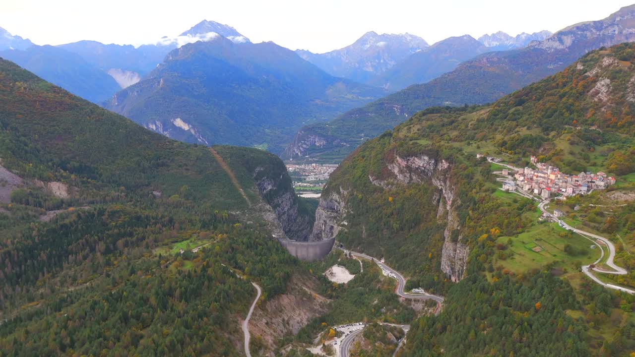 Soaring above the Vajont Dam, revealing its massive structure and history.