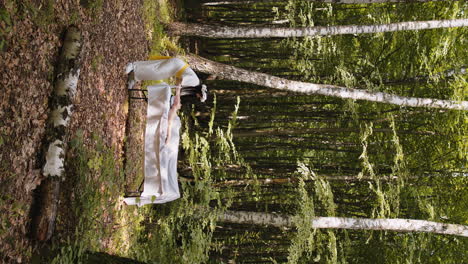 Therapist-female-doctor-making-woman-relaxing-spa-face-massage-with-hands-outdoors-in-the-forest