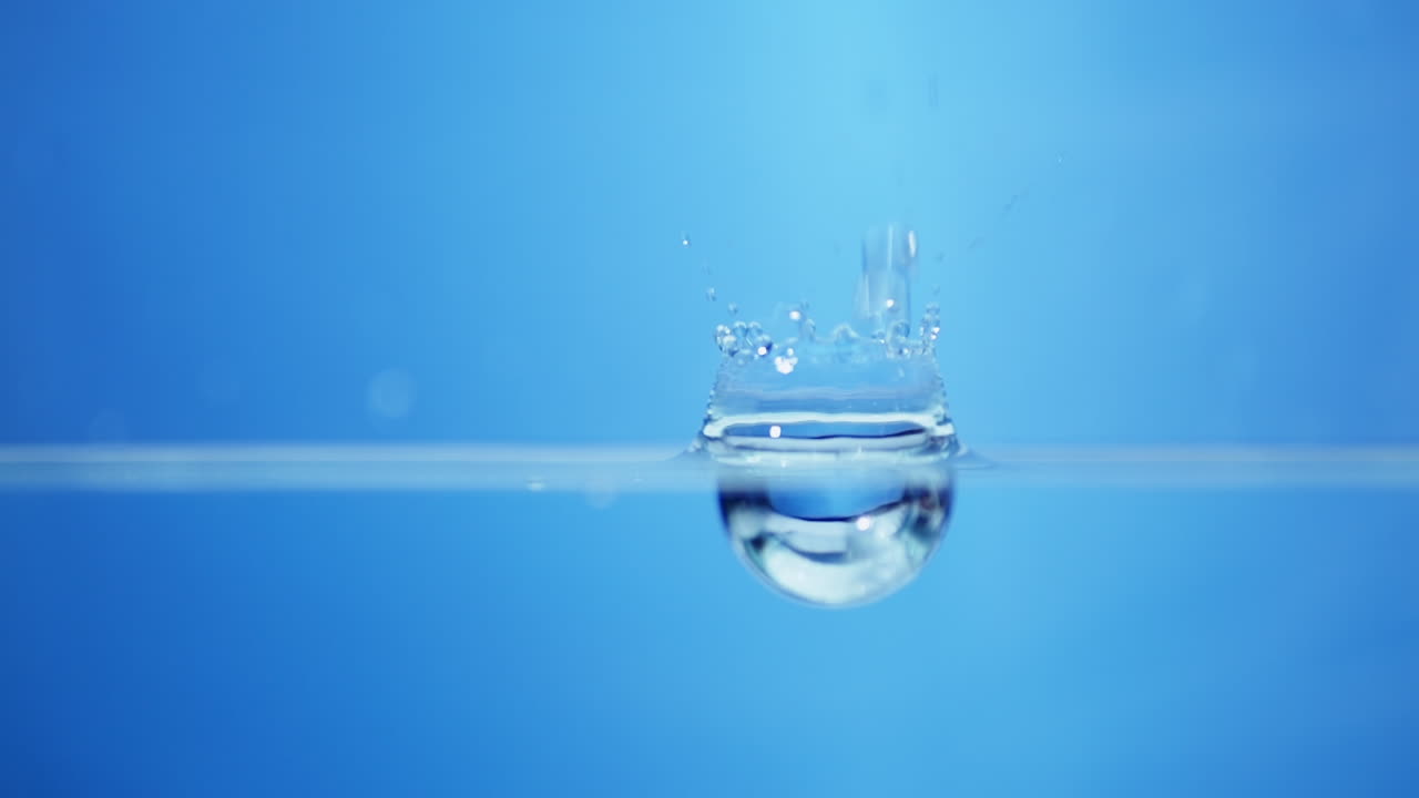 Radiant close-up of water waves in slow motion, highlighting the purity and freshness ideal for promoting drinking water.