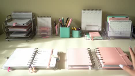 a neatly organized workspace featuring colorful stationery, planners, and tools for efficient planning and note-taking in a light and inviting atmosphere