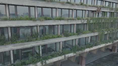 Aerial-Drone-Shot-Krakow-Poland-Abandoned-Soviet-Brutalist-Structure-Hala-Forum-at-Sunrise