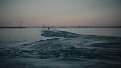 jet ski riding off in distance at dusk in slow motion cinematic watersports seadoo 4k