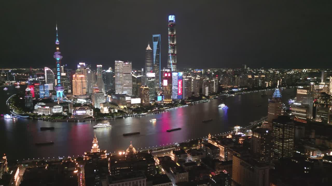 Shanghai Cityscape at Night with Illuminated Buildings and Huangpu River