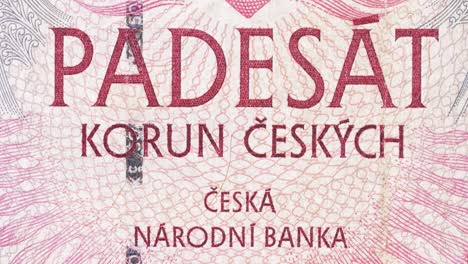 tilt macro reveal of czech national bank text on a czech koruna note