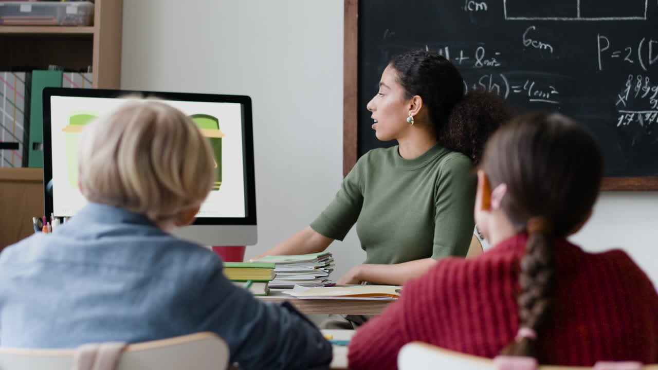 Teacher Presenting a Lesson on Geometry to Students in the Classroom