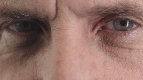 close-up-mature-man-opening-eyes-looking-at-camera